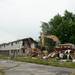 Demolition begins on the first of 17 buildings.